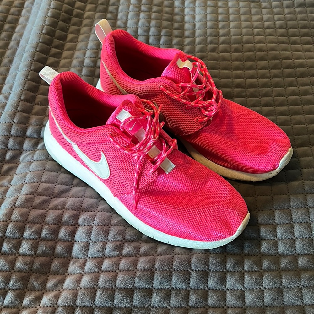 Bright pink Nike shoes
